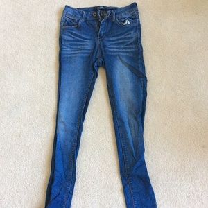 blue jeans with painted back pockets